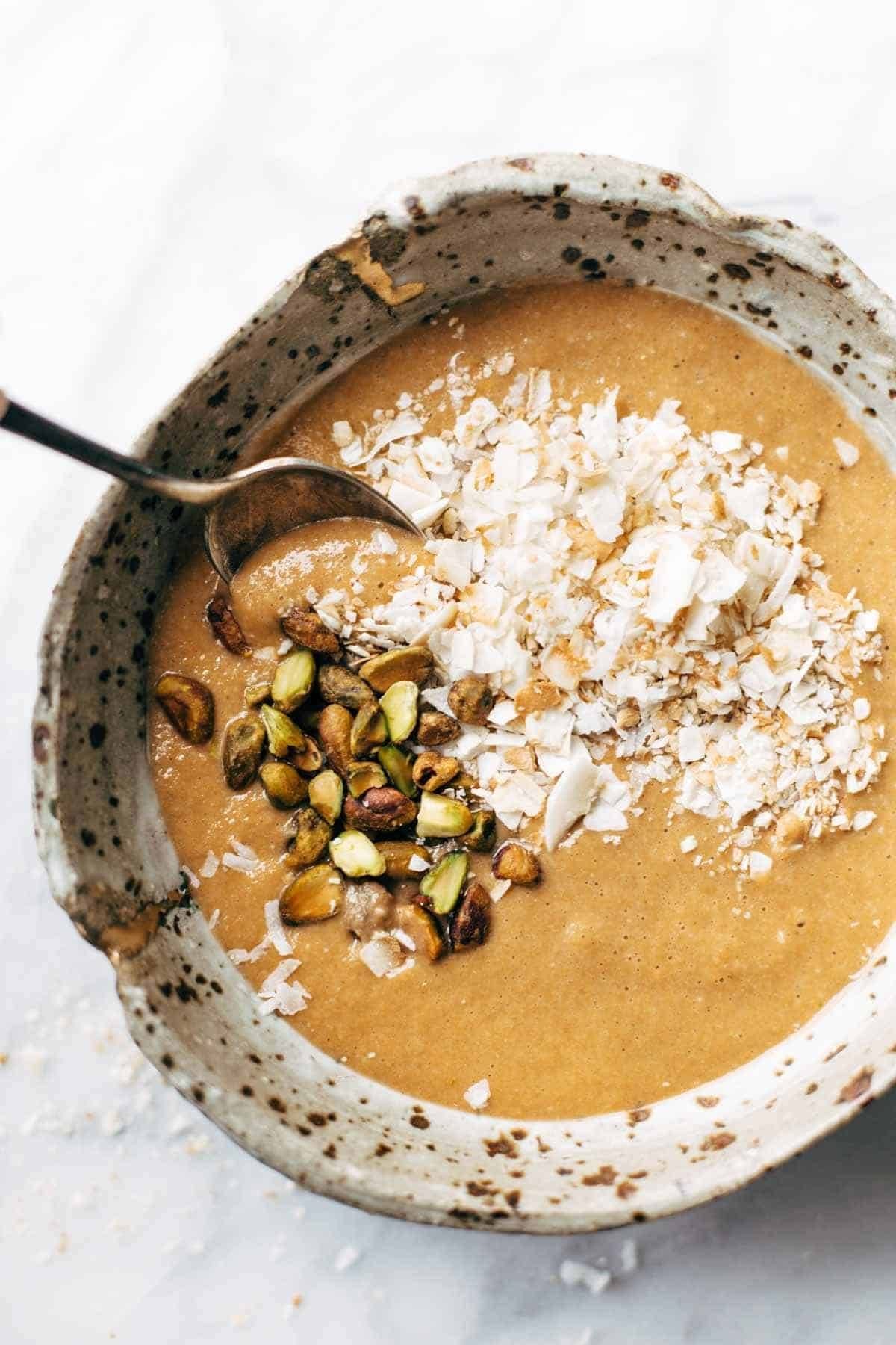 Carrot Cake Smoothie Bowl - an easy, nutrition-packed dessert or snack recipe with a secret super-healthy ingredient! Guilt-free snack! | pinchofyum.com