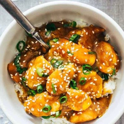 Sesame Mango Chicken Teriyaki in bowls with rice.