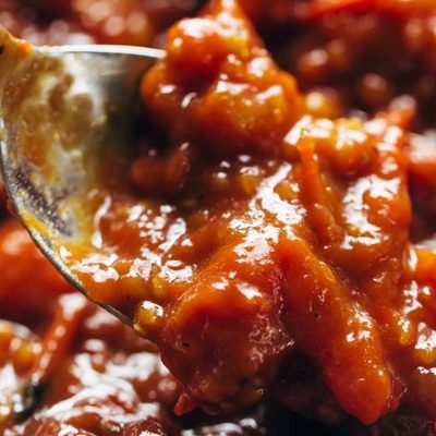 Tomato Butter Sauce in pan with spoon.